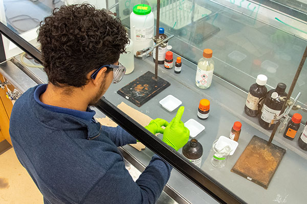 student performing experiment in a chemistry lab
